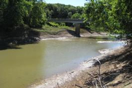 Bridge and dirt streambanks at Santa Fe Access