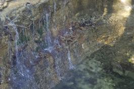 Water trickles over a waterfall at Henning CA 