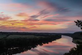 Colorful sunset reflected in the Osage River from a scenic overlook at Painted Rock CA