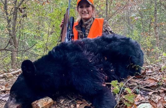 Kelsie Wikoff with harvested bear