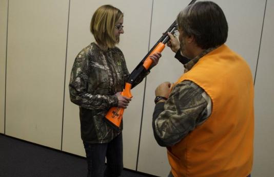 Woman takes hunter ed skills session
