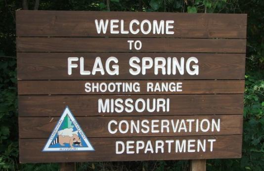 Flag Spring Shooting Range sign
