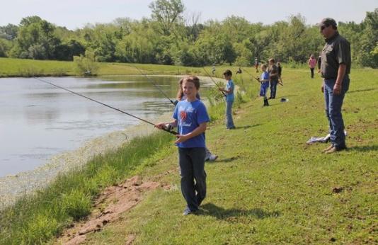 Kids fishing at pond