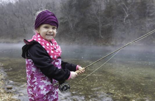 Little girl trout fishing at Bennett Spring State Park