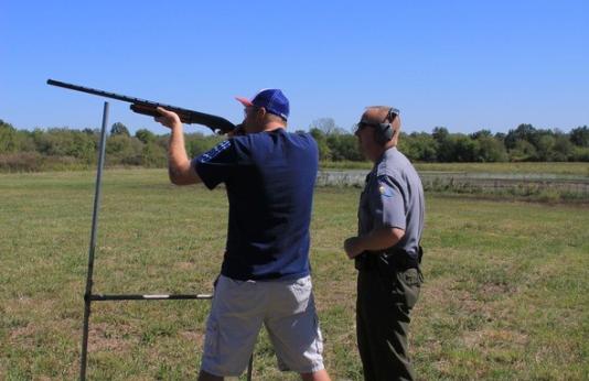 Agent helps man shoot clays 