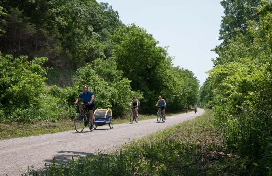 Family riding bikes on the Katy Trail