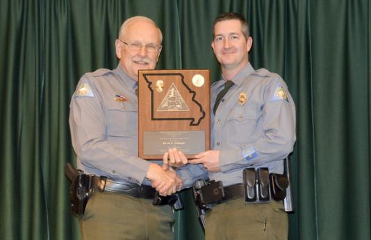 Lincoln County Conservation Agent Kevin Eulinger receiving an award.