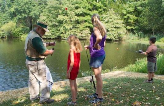 Kids fishing with an MDC instructor.