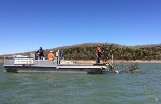MDC staff drop habitat structures from a boat in Norfork Lake