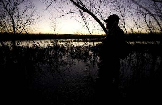 Duck hunter at dawn at Nodaway Valley Conservation Area 