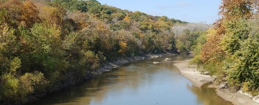 View of Upper Grand River showing autumn trees along both banks.